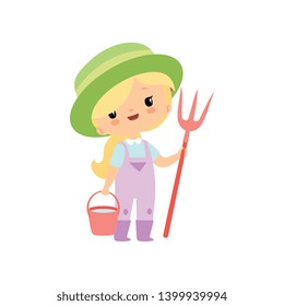 Cute Young Girl in Overalls, Rubber Boots and Hat Standing with Pitchfork and Bucket, Farmer Girl Cartoon Character Vector Illustration
