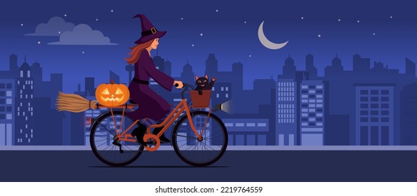 Cute young witch riding a bicycle with her black cat at night in the city street, she is carrying a broom and a pumpkin