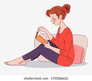 Cute, young woman reading a book 