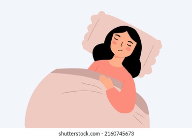 cute young woman sleeping uder blanket