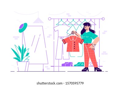 Cute young woman standing in front of hanger rack and trying to choose outfit. Smiling girl in dressing room. Funny female character holding clothes. Cartoon modern vector illustration in flat style.