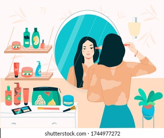 Cute Young woman standing in front of mirror, applies makeup on your face. Face and body care concept flat vector illustration in modern style. Flat cartoon vector illustration.