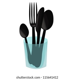 Cutlery in a blue glass
