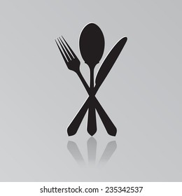 Cutlery - knife, fork and spoon with shadow on a light background