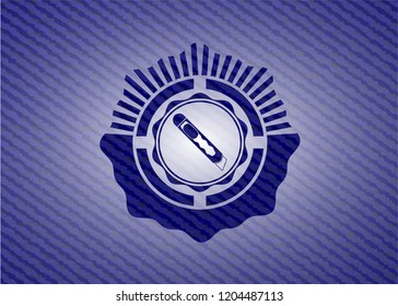 cutter icon inside badge with denim background