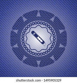 cutter icon inside badge with denim texture