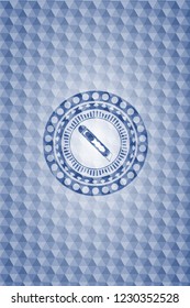 cutter icon inside blue emblem or badge with geometric pattern background.