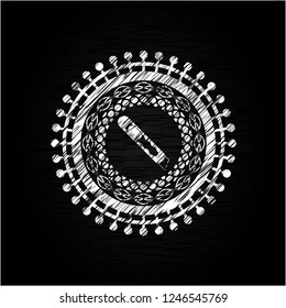 cutter icon inside chalk emblem written on a blackboard
