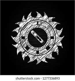cutter icon inside chalkboard emblem on black board