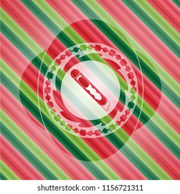cutter icon inside christmas badge background.