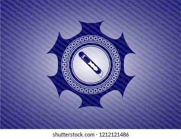 cutter icon inside denim background