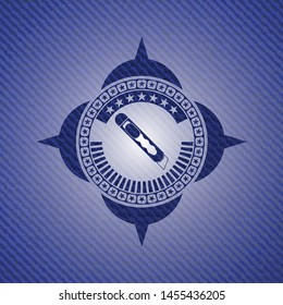 cutter icon inside denim background