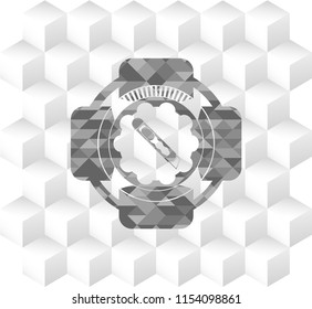 cutter icon inside grey badge with geometric cube white background
