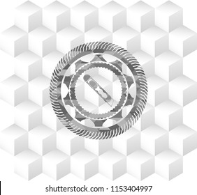 cutter icon inside grey emblem with cube white background