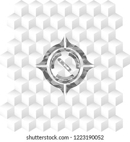 cutter icon inside grey emblem with geometric cube white background