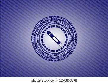 cutter icon inside jean or denim emblem or badge background