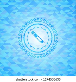 cutter icon inside light blue mosaic emblem