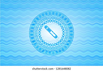 cutter icon inside light blue water wave badge.