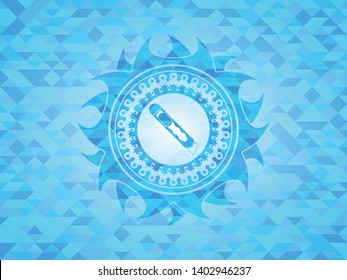 cutter icon inside light blue emblem with mosaic background