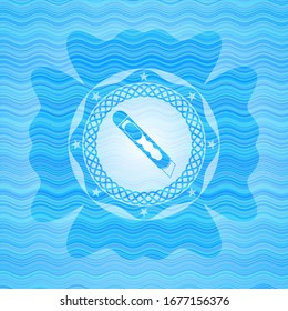cutter icon inside light blue water emblem.