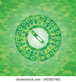 cutter icon inside realistic green mosaic emblem