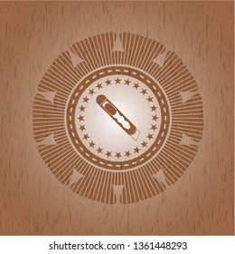 cutter icon inside realistic wood emblem
