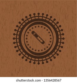 cutter icon inside realistic wooden emblem