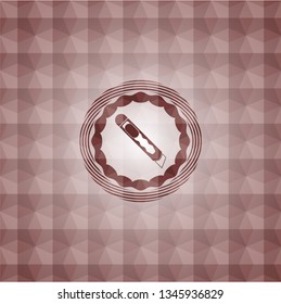 cutter icon inside red seamless emblem or badge with abstract geometric polygonal pattern background.