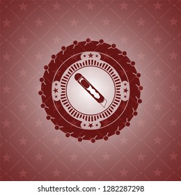 cutter icon inside retro style red emblem