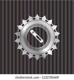 cutter icon inside silver badge or emblem