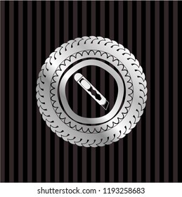 cutter icon inside silvery badge