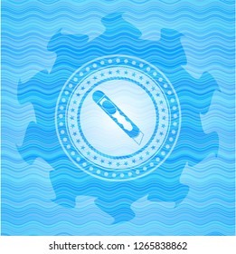 cutter icon inside sky blue water wave emblem.