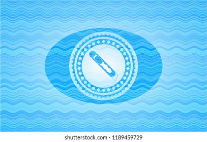 cutter icon inside water concept emblem.