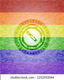 cutter icon on mosaic background with the colors of the LGBT flag