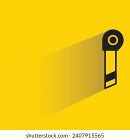 cutter knife icon with shadow on yellow background