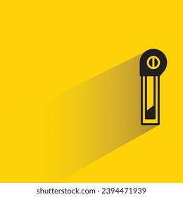cutter knife with shadow on yellow background