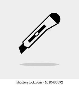 Cutter vector icon isolated on grey background. Knife vector icon