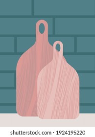 Cutting boards flat vector illustration. Wooden cutting boards isolated on brick wall. Vector stock illustration. Chopping board. Kitchen tool.