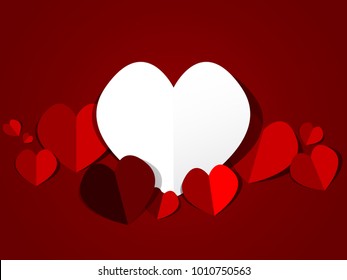 Cutting heart on the red background.