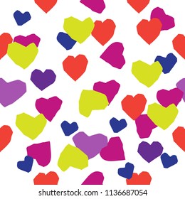 Cutting hearts for Valentine's day holiday. Colorful pattern with from colored paper.