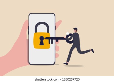 Cyber security, hacker steal money online, phishing or digital banking threat concept, hand holding mobile smart phone with lock with keyhole with criminal thief using key to unlock and steal money.