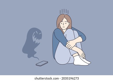 Cyberbullying and abuse in internet concept. Young sad depressed girl cartoon character sitting looking on smartphone with monster flying over it vector illustration 