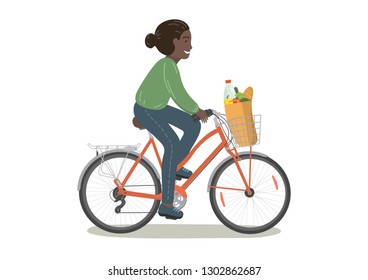 Cycling african woman with grocery bag. Woman on bike. Bicycle with basket. 