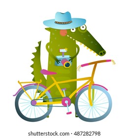 Cyclist crocodile tourist with blue hat, suitcase and camera. Funny wildlife drawing. Cartoon characters for children. Vector hand drawn illustration in vivid colors