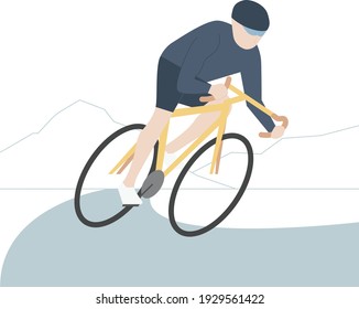 Cyclist cycling fast through the mountain on the road