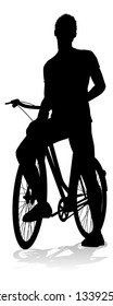 A Cyclist And His Bike In Silhouette