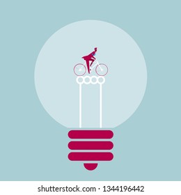 The cyclist is in the light bulb. Isolated on blue background.