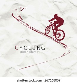 Cyclist on the background of crumpled paper