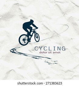 Cyclist on the background of crumpled paper