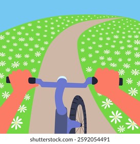 cyclist rides along a path in flower fields